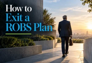 usiness owner reviewing ROBS 401(k) exit paperwork with a retirement plan administrator
