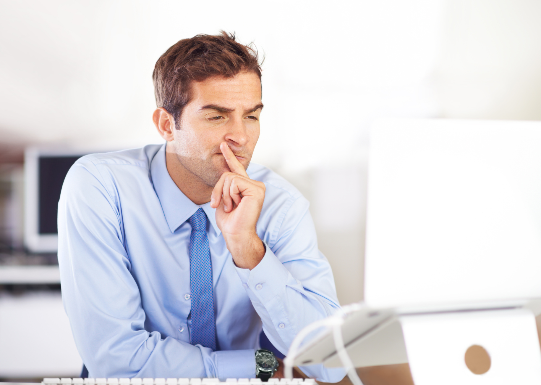 Man thinking at computer